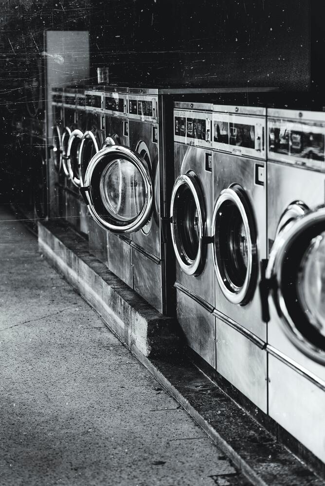 black and white row of laundry machines